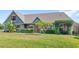 Inviting single-story home showcasing a well-manicured lawn and decorative shrubbery at 1880 Lorraine Way, St Cloud, FL 34769