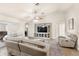 Comfortable living area with vaulted ceilings, fan, built-in entertainment center and doors to the backyard at 1880 Lorraine Way, St Cloud, FL 34769