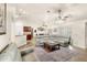 Open-concept living space with ample seating, ceiling fans, and access to the dining room at 1880 Lorraine Way, St Cloud, FL 34769