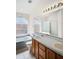 Bright bathroom featuring a double vanity, soaking tub, and shower at 1919 River Park Blvd, Orlando, FL 32817
