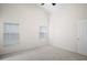 Spacious bedroom with plush carpet, two windows, and closet at 1919 River Park Blvd, Orlando, FL 32817