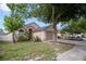 Inviting single-story home with lush landscaping, two car garage and sidewalk at 1919 River Park Blvd, Orlando, FL 32817