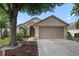 Single-story home with landscaped yard, two-car garage and covered front entryway at 1919 River Park Blvd, Orlando, FL 32817