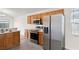 Kitchen featuring oak cabinets, stainless steel appliances, and lots of natural light at 1919 River Park Blvd, Orlando, FL 32817