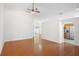 A spacious living room featuring hardwood floors, and an open floor plan, next to the kitchen at 1919 River Park Blvd, Orlando, FL 32817