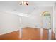 Open-concept living room boasts vaulted ceilings and hardwood floors at 1919 River Park Blvd, Orlando, FL 32817