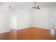 Bright living room featuring hardwood floors and vaulted ceilings with fan at 1919 River Park Blvd, Orlando, FL 32817