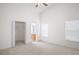 Bright main bedroom with plush carpet, closet, and connecting bath at 1919 River Park Blvd, Orlando, FL 32817