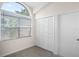 Bright room with large window, closet, and tile floors at 1919 River Park Blvd, Orlando, FL 32817