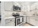 Modern kitchen with stainless steel appliances, quartz countertops, and ample cabinet space at 2040 E Triangle Dr, Longwood, FL 32779