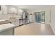 Modern kitchen with stainless steel appliances, quartz countertops, and ample cabinet space at 2040 E Triangle Dr, Longwood, FL 32779