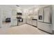 Modern kitchen with stainless steel appliances, quartz countertops, and ample cabinet space at 2040 E Triangle Dr, Longwood, FL 32779