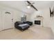 Cozy living room with tiled floors, fireplace, ceiling fan, and a comfortable black leather couch at 2040 E Triangle Dr, Longwood, FL 32779