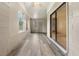 Sunroom with tile flooring, windows, and a sliding door to the outside at 2040 E Triangle Dr, Longwood, FL 32779