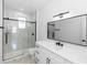 Sleek bathroom with marble-look shower, black hardware, and integrated countertop sink at 21 N Hampton Ave # Lot 2, Orlando, FL 32803