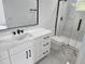 Modern bathroom featuring a vanity with marble countertop and frameless glass shower at 21 N Hampton Ave # Lot 2, Orlando, FL 32803
