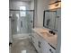 Bright bathroom with a walk-in shower and marble countertops, creating a luxurious feel at 21 N Hampton Ave # Lot 2, Orlando, FL 32803