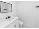 Bathroom featuring a modern sink, a toilet and a large mirror on the wall at 21 N Hampton Ave # Lot 2, Orlando, FL 32803