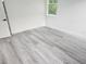 Bright, airy bedroom with light gray flooring and a window at 21 N Hampton Ave # Lot 2, Orlando, FL 32803