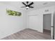 A bright bedroom featuring gray floors, bright walls, and a large closet at 21 N Hampton Ave # Lot 2, Orlando, FL 32803