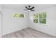 Bedroom with light walls, a fan, and a bright window with trees visible outside at 21 N Hampton Ave # Lot 2, Orlando, FL 32803