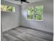 Bedroom with modern ceiling fan and multiple windows at 21 N Hampton Ave # Lot 2, Orlando, FL 32803
