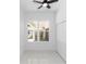 Bright bedroom with a window overlooking the outside and tile flooring at 21 N Hampton Ave # Lot 2, Orlando, FL 32803