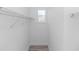 Walk-in closet featuring wire shelving and a small window at 21 N Hampton Ave # Lot 2, Orlando, FL 32803
