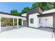 Modern home featuring a spacious deck with a covered parking area and sleek architectural details at 21 N Hampton Ave # Lot 2, Orlando, FL 32803