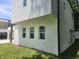 Side exterior view showcasing a home with modern architecture and neat landscaping at 21 N Hampton Ave # Lot 2, Orlando, FL 32803