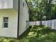 Exterior of the home showing the side yard and modern architecture, with a well-manicured lawn at 21 N Hampton Ave # Lot 2, Orlando, FL 32803