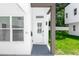 Modern townhome entrance featuring a decorative glass front door and a sleek, minimalist design at 21 N Hampton Ave # Lot 2, Orlando, FL 32803