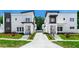 Modern townhomes showcasing contemporary architecture and landscaped front yards at 21 N Hampton Ave # Lot 2, Orlando, FL 32803