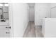 White hallway with visible bath and bedroom entrances at 21 N Hampton Ave # Lot 2, Orlando, FL 32803
