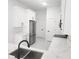 Bright kitchen featuring white cabinets, stainless steel appliances, and modern countertops at 21 N Hampton Ave # Lot 2, Orlando, FL 32803