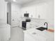 Bright kitchen featuring white cabinets, stainless steel appliances, and modern countertops at 21 N Hampton Ave # Lot 2, Orlando, FL 32803