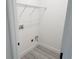 Empty laundry room with wood flooring and a wire rack for storage creating a functional space at 21 N Hampton Ave # Lot 2, Orlando, FL 32803