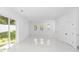 Bright living room with white walls, tile flooring, and large sliding glass doors at 21 N Hampton Ave # Lot 2, Orlando, FL 32803