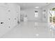 Bright open-concept living room with white tile floors, offering a versatile living space at 21 N Hampton Ave # Lot 2, Orlando, FL 32803