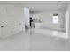 Spacious open-plan living area features tile flooring, recessed lighting, and kitchen view at 21 N Hampton Ave # Lot 2, Orlando, FL 32803