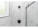Modern shower featuring marble-style tile and sleek, black fixtures at 21 N Hampton Ave # Lot 2, Orlando, FL 32803