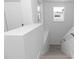 Bright stairwell with contemporary white walls and wood-look flooring at 21 N Hampton Ave # Lot 2, Orlando, FL 32803