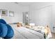 Cozy bedroom with two twin beds, closet, and ensuite bath provides a comfortable and private retreat at 217 Holborn Loop, Davenport, FL 33897