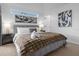 Modern bedroom with plush bedding, stylish lamps, and contemporary wall art at 217 Holborn Loop, Davenport, FL 33897