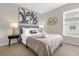 Comfortable bedroom with neutral tones, ample natural light, and stylish decor creates a serene atmosphere at 217 Holborn Loop, Davenport, FL 33897
