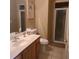 Clean bathroom with a glass-enclosed shower, vanity with sink, and neutral tile flooring at 225 Vista Dr, Davenport, FL 33897