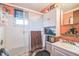 Bathroom featuring a shower stall, white cabinets, and peach colored walls at 24089 Ne 152Nd Ln, Fort Mc Coy, FL 32134