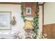 Bedroom with a lamp and wooden box with greenery at 24089 Ne 152Nd Ln, Fort Mc Coy, FL 32134