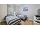 Inviting bedroom featuring twin beds with soft, patterned bedding and ample natural light at 3055 Beach Palm Ave, Kissimmee, FL 34747