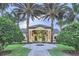 Stately home featuring meticulously manicured landscaping and palm trees at 3055 Beach Palm Ave, Kissimmee, FL 34747